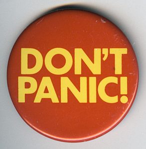 Round button with the words "don't panic" written in big friendly letters